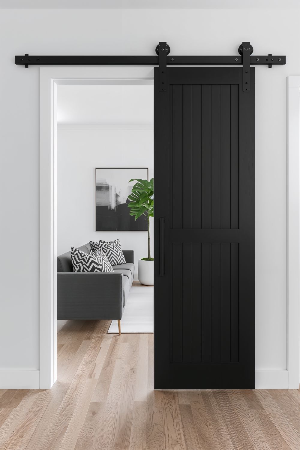 Black Matte Barn Door With Industrial Hardware In Modern Living Room
