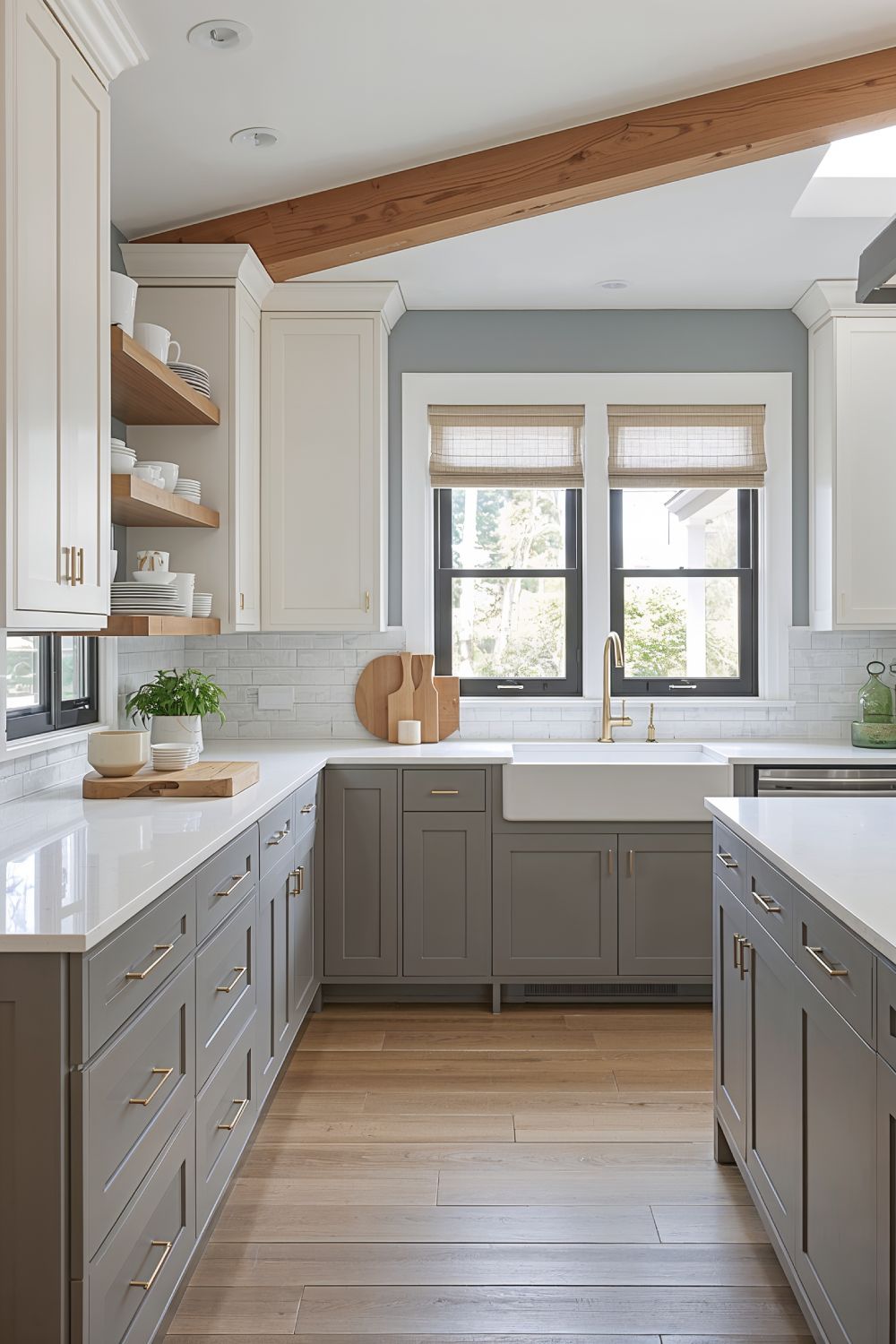 Two Tone Kitchen Cabinets With Alabaster White Uppers And Anew Gray Lower Cabinets Against Agreeable Gray Walls
