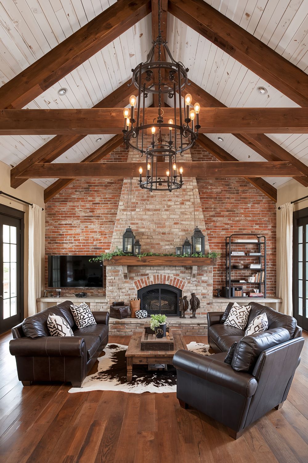 Exposed Brick Wall With Reclaimed Wood Beams In Rustic Living Room