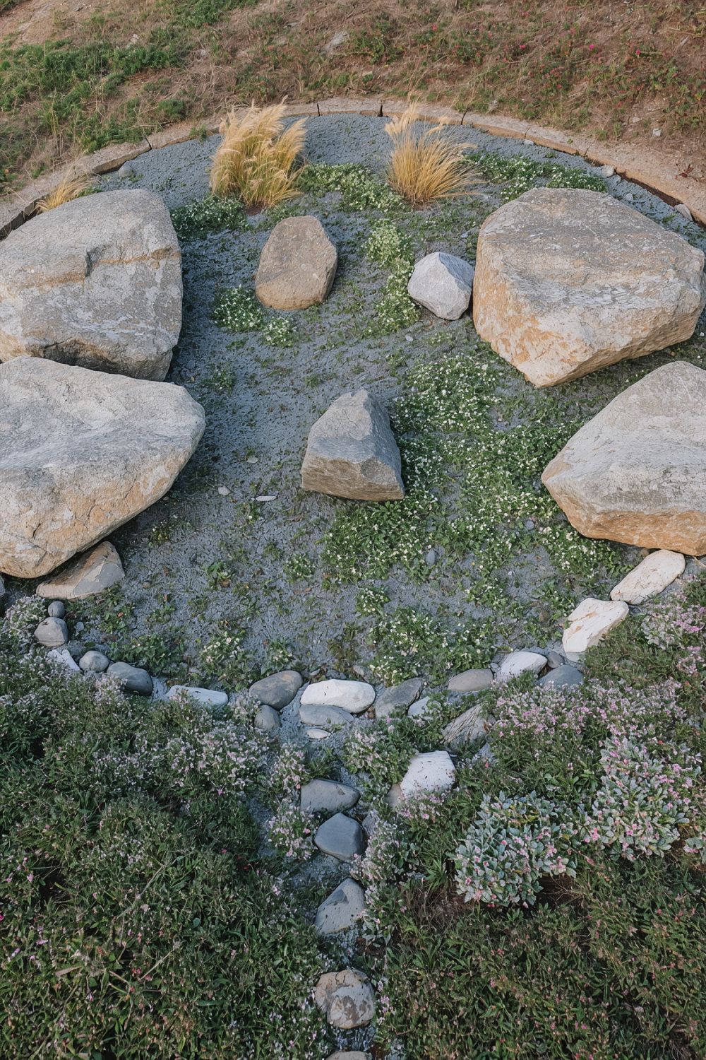 Natural Granite Boulder Seating With Beach Groundcover