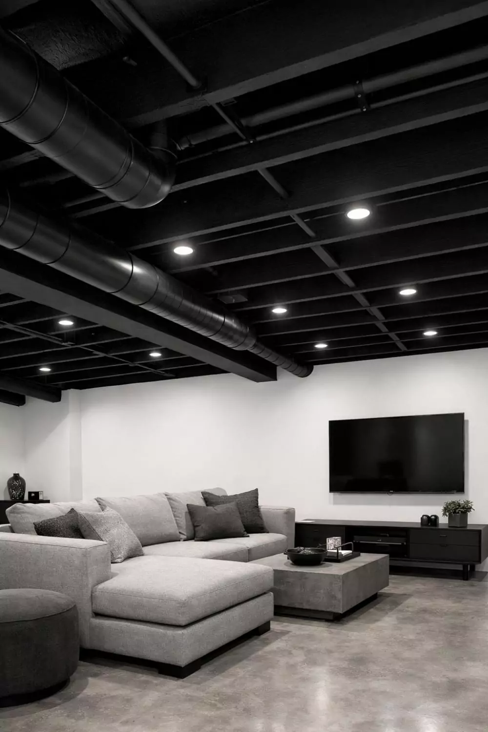 Black Painted Exposed Ceiling Low Basement Design