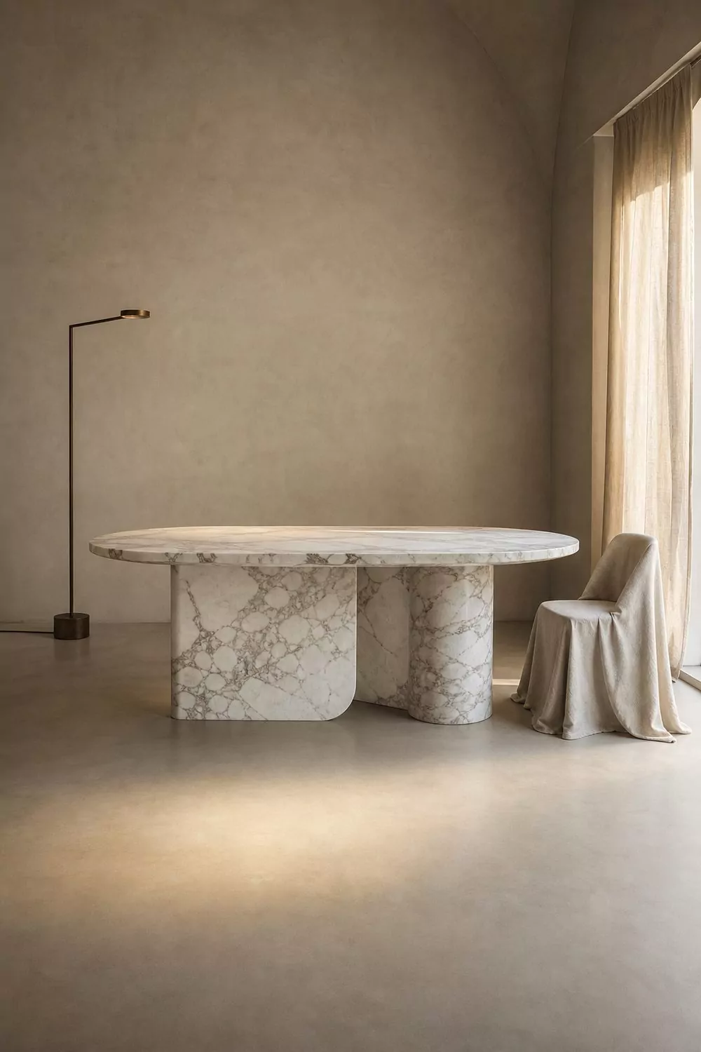 Minimalist luxury showroom with one hero marble table on a wide empty floor, soft monochrome palette and a single dramatic light pool