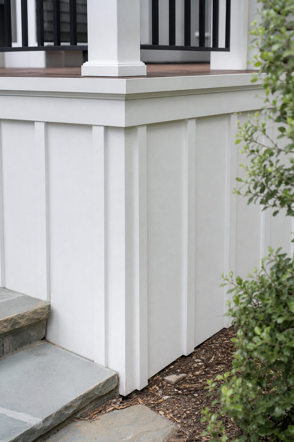 Board and Batten Deck Skirting on a raised backyard deck, soft white painted board and batten, bright midday diffused daylight