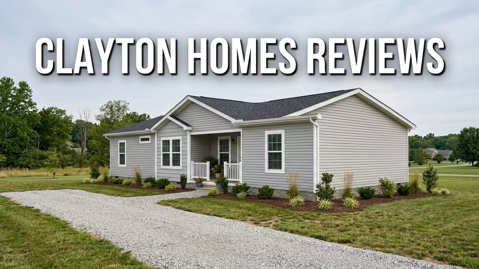 Grey single-story Clayton manufactured home with a covered porch and gravel drive, with the text Clayton Homes Reviews across the top