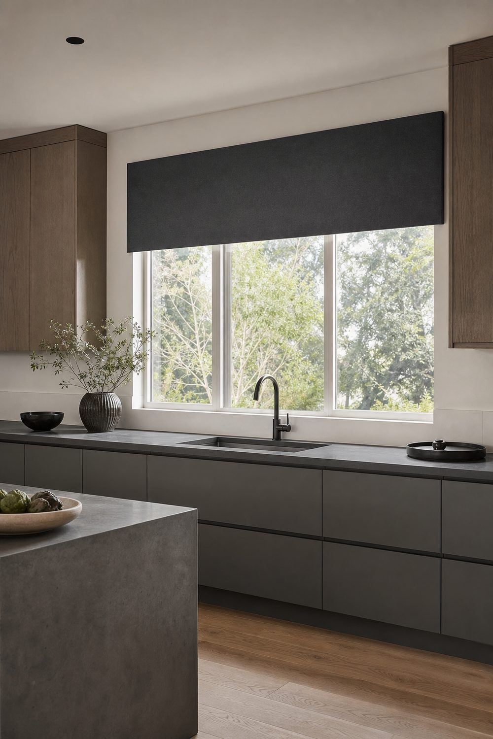 Flat charcoal fabric panel hanging straight above a contemporary kitchen window with slab cabinets