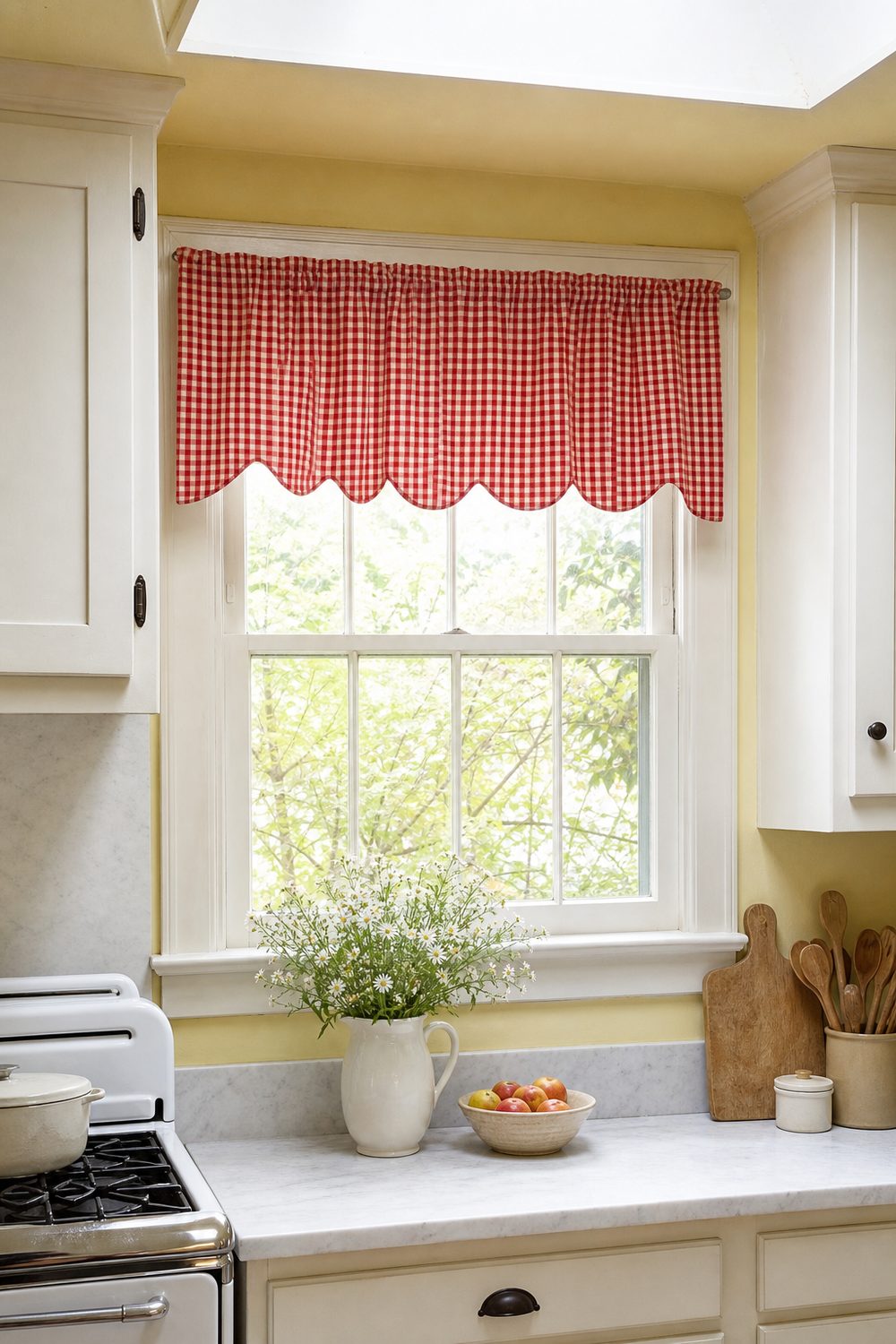 Red and white gingham valance with a scalloped lower edge above a vintage kitchen window with yellow walls
